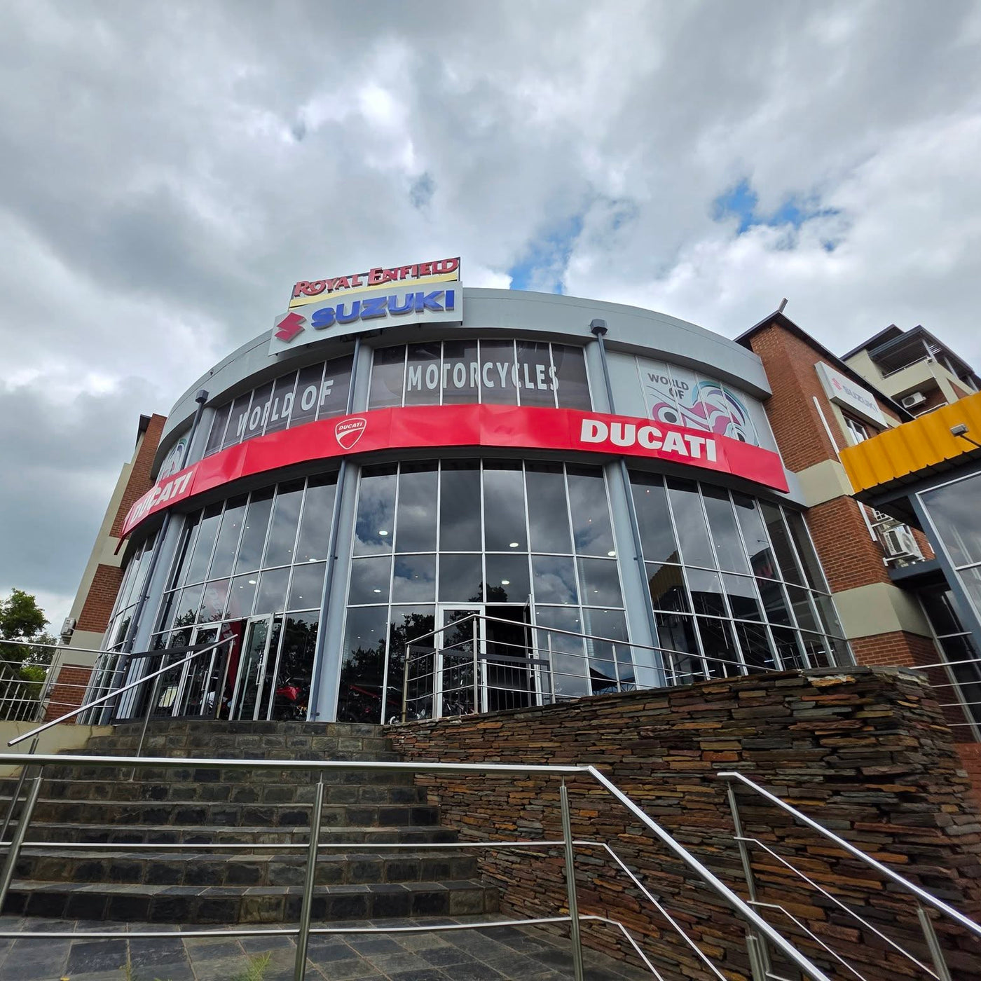 Royal Enfield Gauteng dealership with a cloudy sky background